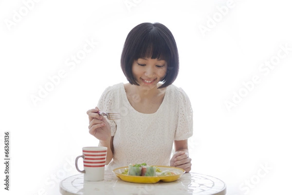 Fototapeta 食事をする女性