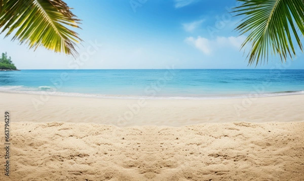 Fototapeta Sunlit sand foreground with a soft-focus palm tree.