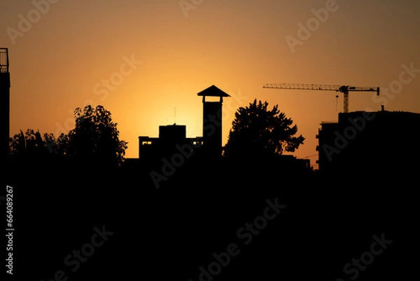 Fototapeta sunset over city