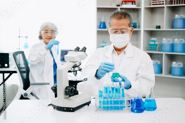 Obraz Scientist team meeting and writing analysis results in the laboratory study and analyze scientific sample