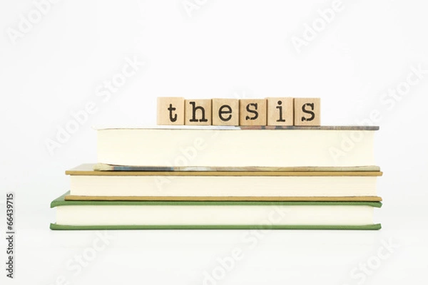 Fototapeta thesis word on wood stamps and books