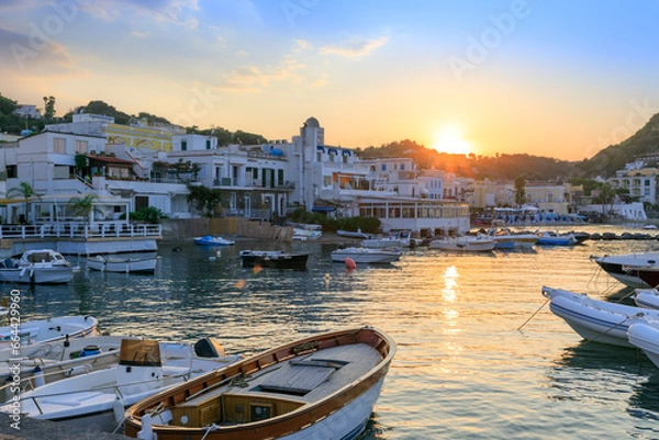 Fototapeta Townscape of Lacco Ameno in Ischia Island. View of tourist port at sunset.