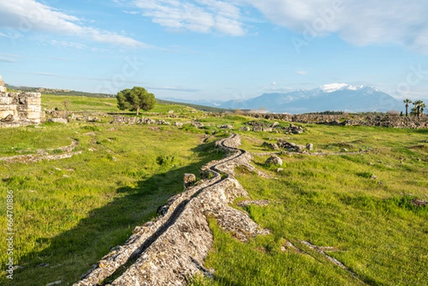 Fototapeta Ancient irrigation system at Hierapolis site in Pamukkale, Turkey. Hierapolis was an ancient Greek city located on hot springs in classical Phrygia in southwestern Anatolia.