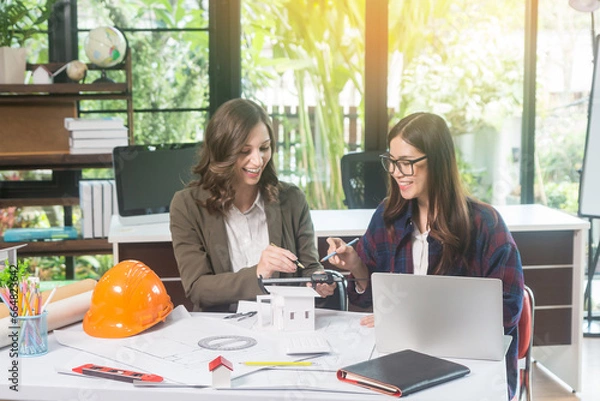 Obraz Architectural woman designer making digital building plan for professional construction renovation in office.