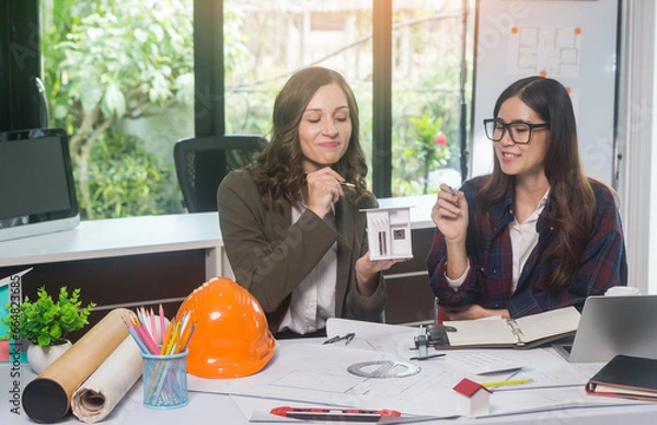 Obraz Architectural woman designer making digital building plan for professional construction renovation in office.