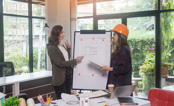 Obraz Architectural woman designer making digital building plan for professional construction renovation in office.