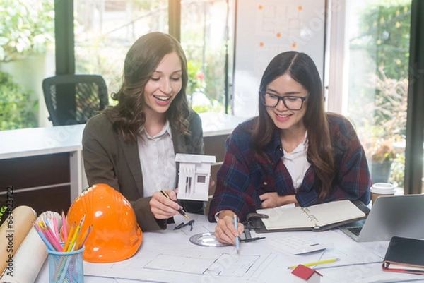 Obraz Architectural woman designer making digital building plan for professional construction renovation in office.