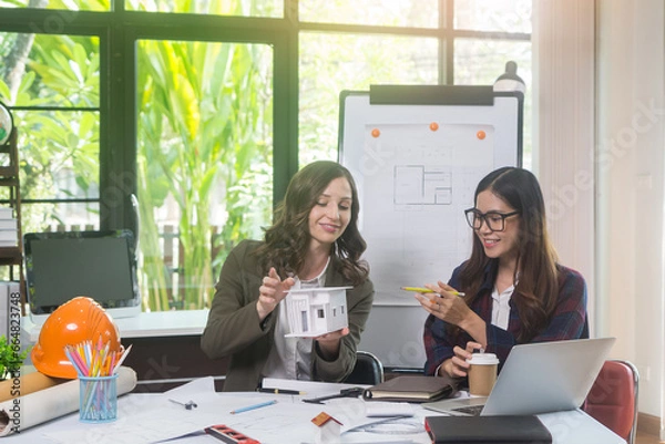 Obraz Architectural woman designer making digital building plan for professional construction renovation in office.