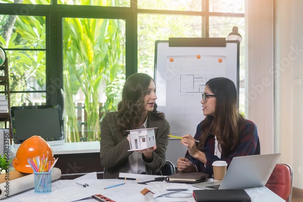 Obraz Architectural woman designer making digital building plan for professional construction renovation in office.