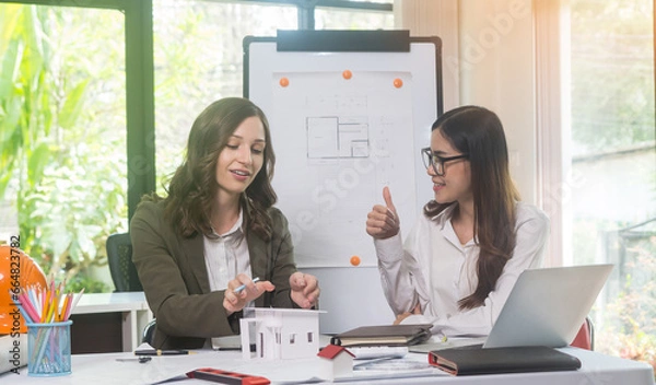 Obraz Architectural woman designer making digital building plan for professional construction renovation in office.