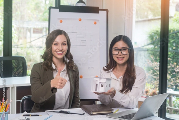 Obraz Architectural woman designer making digital building plan for professional construction renovation in office.