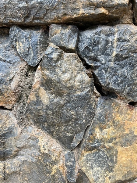 Obraz Large stone background, stacked stone wall.