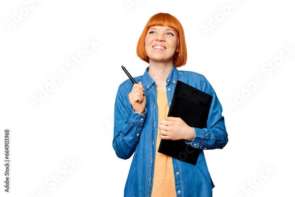 Obraz Smiling female designer holding a graphic tablet.