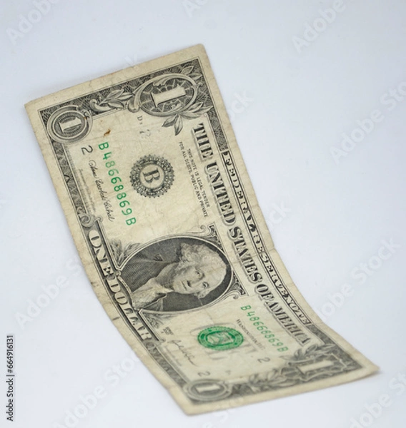 Fototapeta US dollar, USD, is the official currency of the United States and is widely used for transactions within the country, is the world's primary reserve currency, held in large quantities by central banks