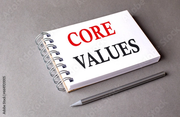 Fototapeta CORE VALUES word on notebook on grey background
