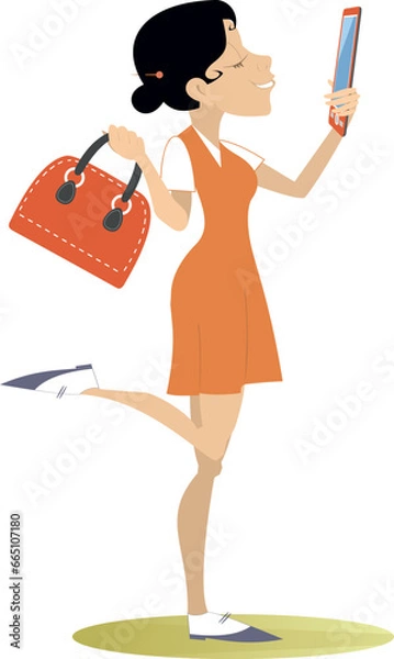 Fototapeta Young woman holding smartphone. 
Happy attractive young woman taking selfie and listening to music from smartphone Isolated on white background
