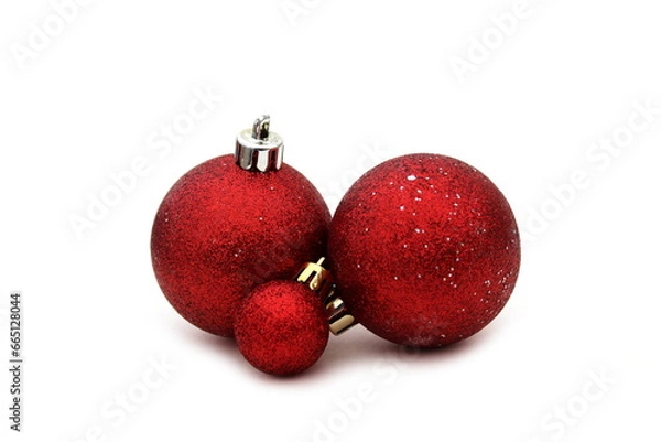 Fototapeta Red balls with sparkles lie against the background.