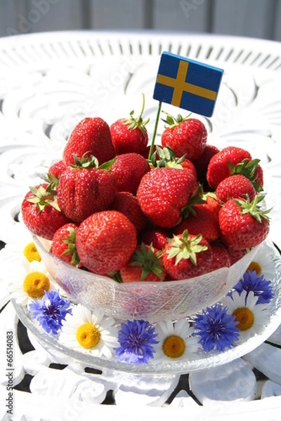 Fototapeta Sweet strawberries for Midsummer with Swedish flag on the top