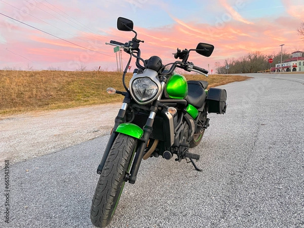 Obraz Motorcycle on the road during sunset