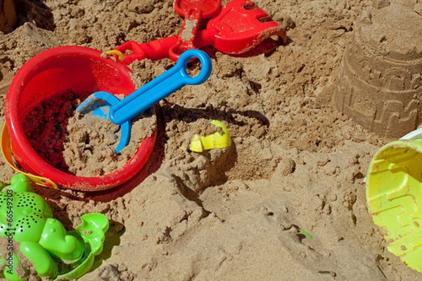 Obraz Pit sand with plastic toys