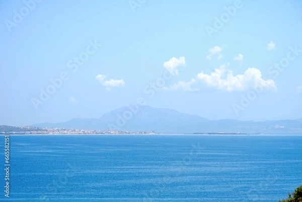 Fototapeta view from the dunes from Valdevaqueros towards Tarifa and the mountains of Morocco behind, Jbel Musa, Costa de la Luz, Andalusia, province of Cádiz, Spain, Travel, Tourism