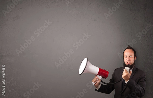 Obraz Guy shouting into megaphone on copy space background