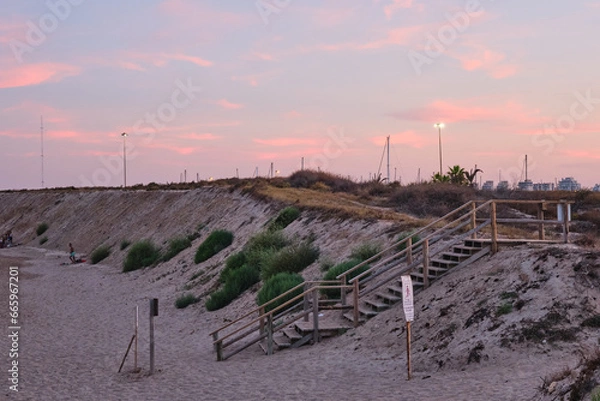 Fototapeta Twilight Dunes: Beach Pathway Under Cotton Candy Skies