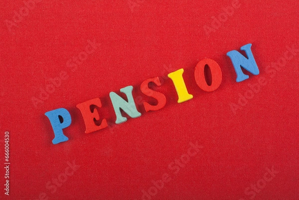 Fototapeta PENSION word on red background composed from colorful abc alphabet block wooden letters, copy space for ad text. Learning english concept.