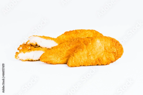 Obraz Fast food. Breaded Chicken Inner Fillet on a White Background,Chicken Breaded Raw Meat. Fast cooking. Breaded chicken nuggets. Homemade food at home. Chicken Breaded Fillet.