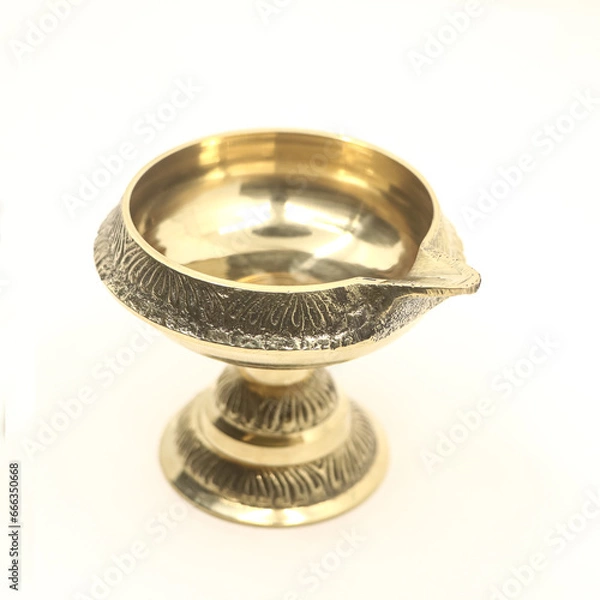 Fototapeta handcrafted brass oil diya lamp with stand used for decorative fire light in hindu festival and ceremony isolated in a white background
