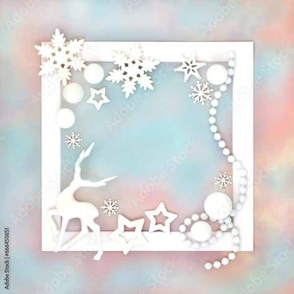 Fototapeta Christmas reindeer snowflake star and ball decoration on white frame on rainbow sky background. Festive abstract fantasy design north pole theme.