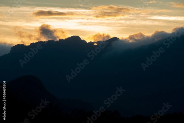Obraz Rolling clouds over mountain