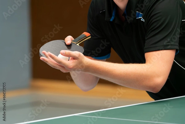 Fototapeta Close up of a table tennis player serving