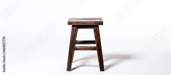 Obraz Backless stool made of dark brown wood isolated on white background