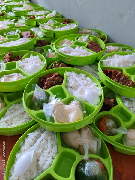 Fototapeta Prepared emlployee meals in round lunch boxes