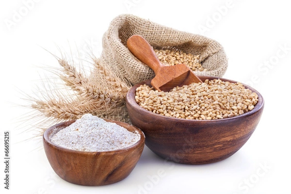 Obraz Ripe wheat and flour in a wooden bowls
