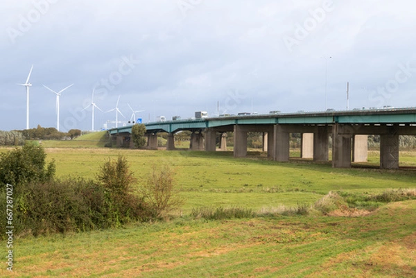 Fototapeta Bridge - Hagesteinsebrug, over the river Lek which is part of the national highway 27 between Vianen and Nieuwegein in the Dutch province of Utrecht.