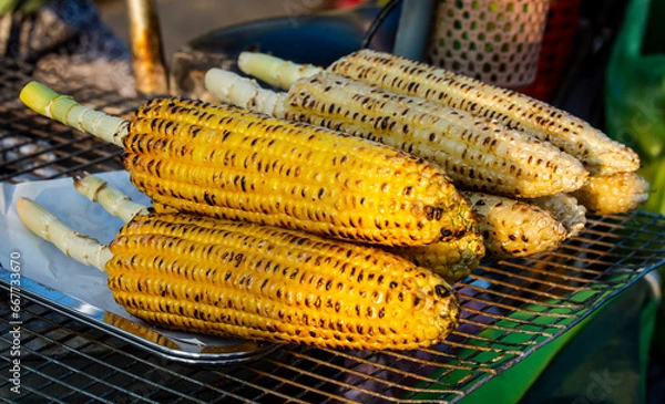 Fototapeta Char grilled corn on cob from Vietnam Hoi An street market