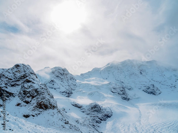 Obraz Snow-covered Piz Palü and surrounding peaks seen from Diavolezza in the Swiss Alps on a clear winter day.