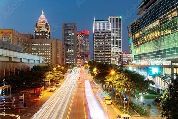 Obraz Nightscape of Downtown Taipei, the vibrant capital city of Taiwan, with high-rise office towers & busy traffic trails on the street in XinYi Financial District~Beautiful cityscape of Taipei after dark