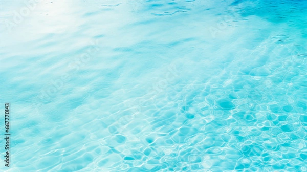 Fototapeta light blue rippled water surface with a slight wave pattern. The water is clear and reflecting the sunlight and has a slight sparkle. Water background.