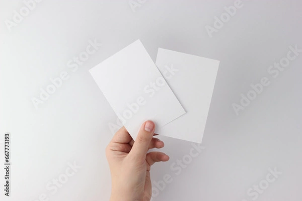 Fototapeta Card mockup in minimalist style, two blank cards in hand
