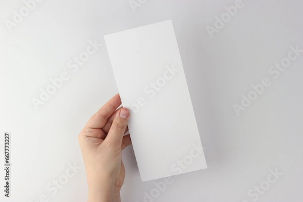 Fototapeta Card mockup in minimalist style, blank card 4x9 in hand
