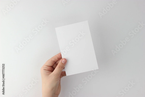 Fototapeta Card mockup in minimalist style, blank card in hand