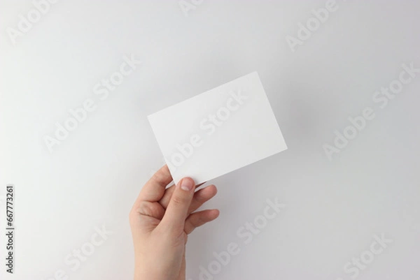 Fototapeta Card mockup in minimalist style, blank card in hand