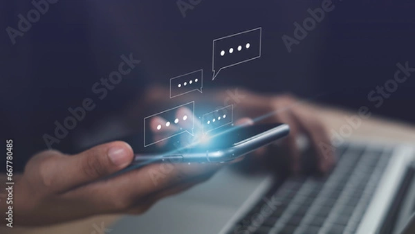 Fototapeta Live chat chatting on application communication concept. Hand using smartphone online typing chat with friend or service help show social media message chat box icon.