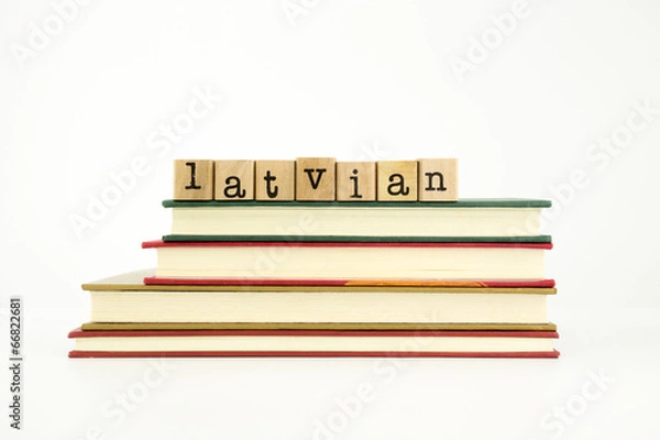 Fototapeta latvian language word on wood stamps and books