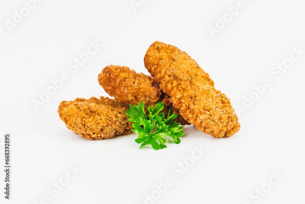 Obraz Breaded Chicken Inner Fillet, Chicken Breaded Raw Meat. Fast cooking.Breaded Chicken nuggets Fillet with salad on a White Background,food at home. Fast homemade food.Chicken breaded schnitzels.