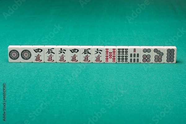 Obraz Smooth table surface with a mahjong on it