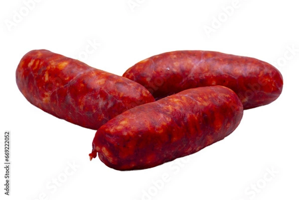 Fototapeta Three fresh chorizos with a piece of Idiazábal sheep cheese on a white plate
